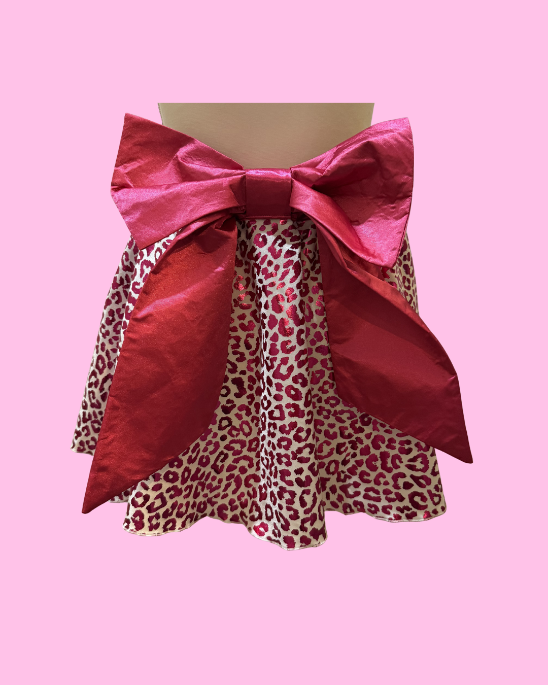 back view sparkly white running skirt with pink cheetah print overlay and hot pink waistband and bow for bold race outfit