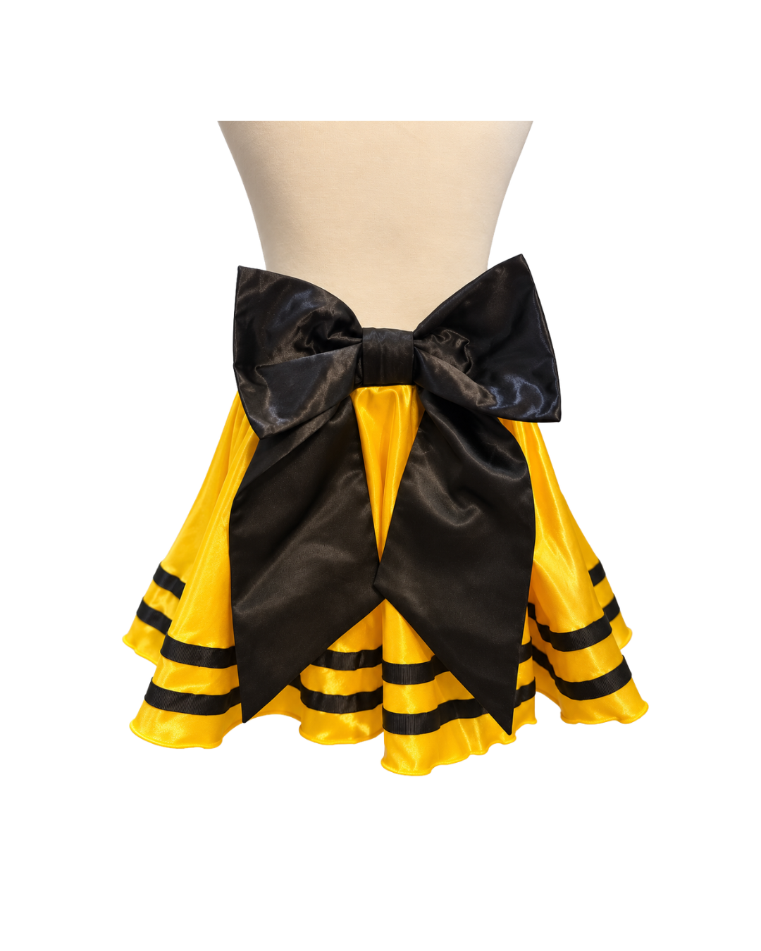 A yellow and black ruffled costume skirt displayed on a beige mannequin torso against a plain white background.