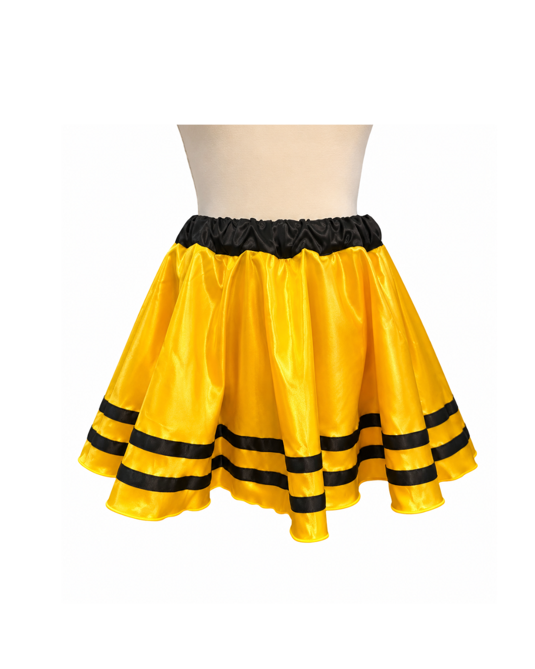 A yellow and black ruffled costume skirt displayed on a beige mannequin torso against a plain white background.