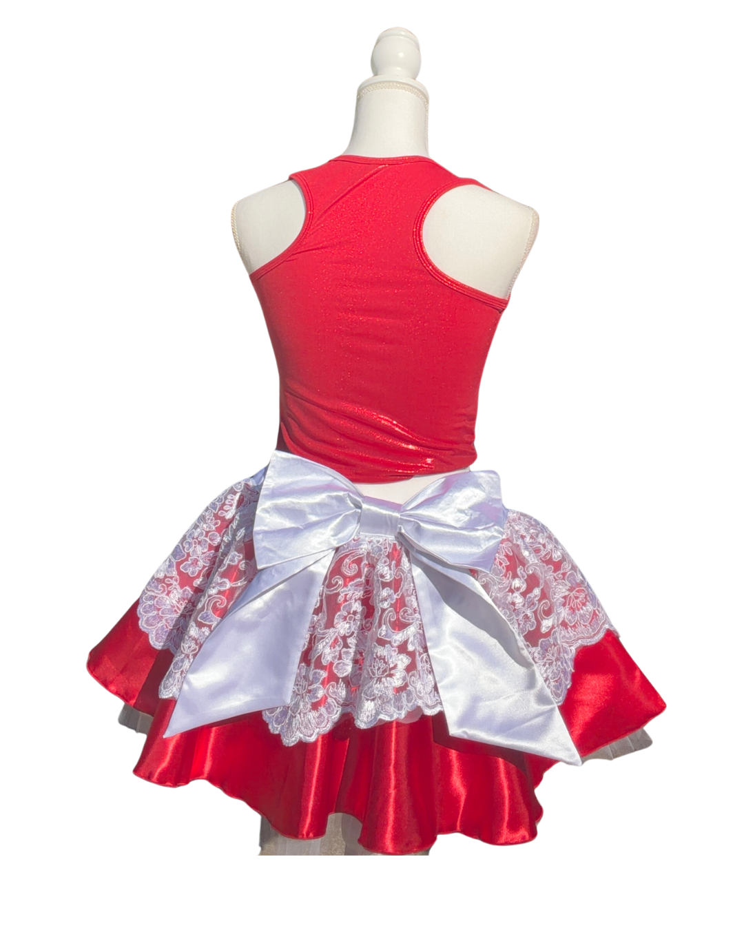 Red satin Christmas running skirt with delicate white lace overlay and white satin waistband, paired with a red running top.